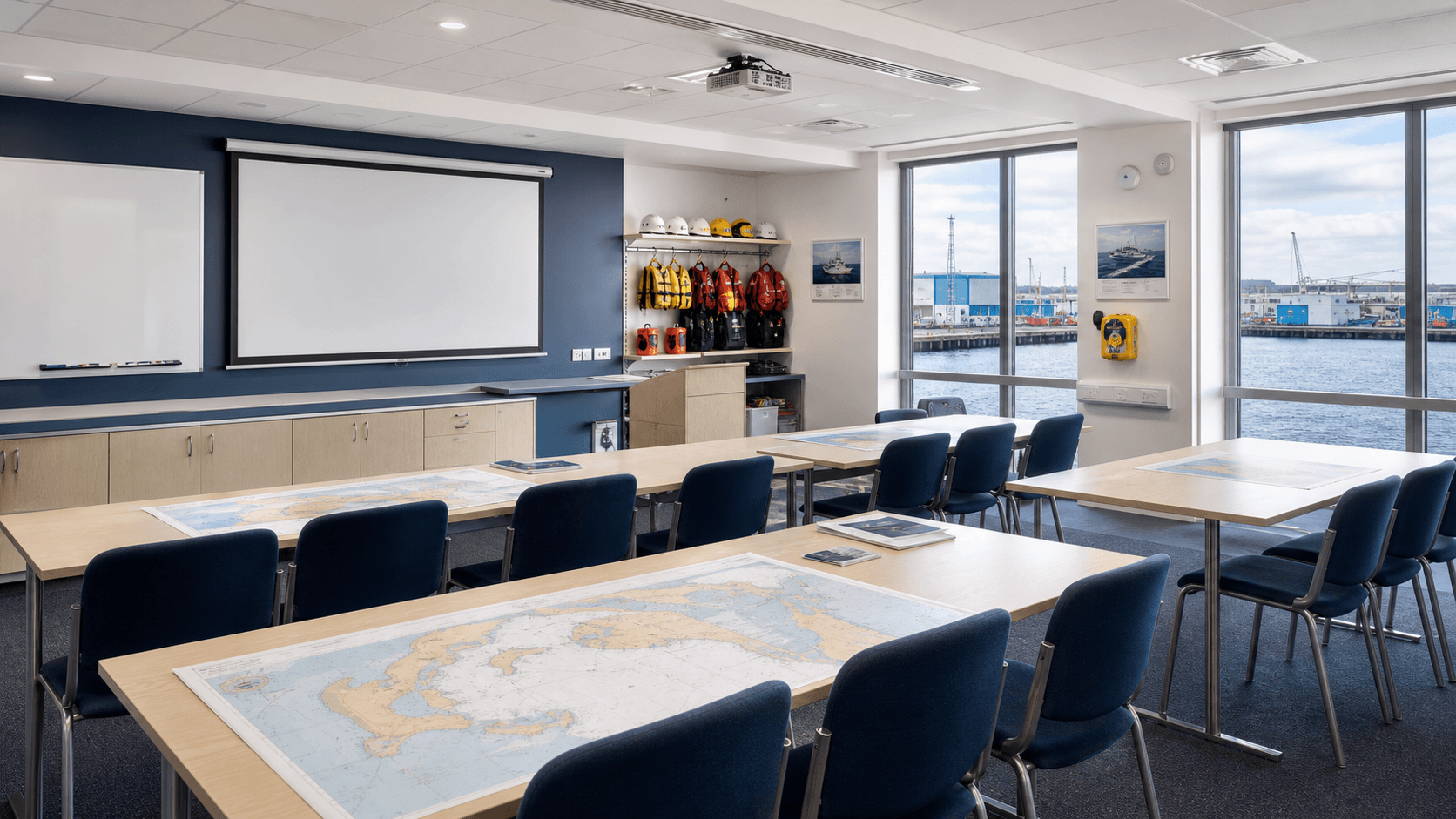 Prepared maritime training classroom with harbour views and training equipment
